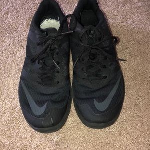 All black nike running or everyday gym shoes.